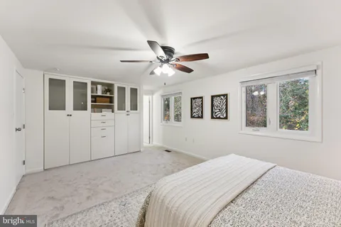 a view of a bedroom with a workspace