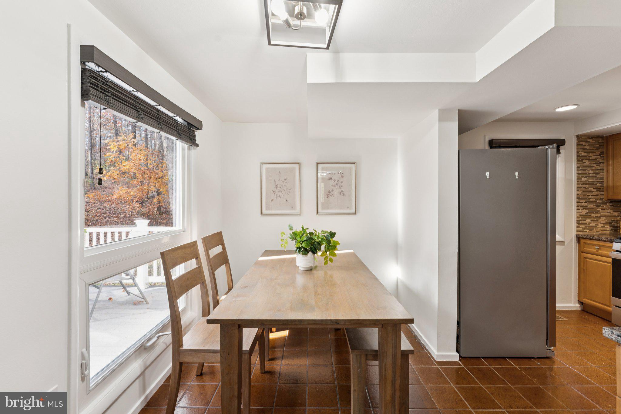 11234 Hunting Horn Lane Reston, VA 20191 - Photo 9 of 44 a view of a dining room with furniture and a window