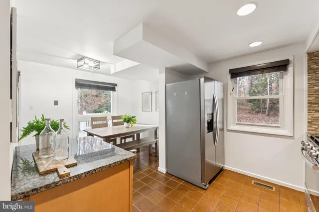 a room with furniture a window and appliances