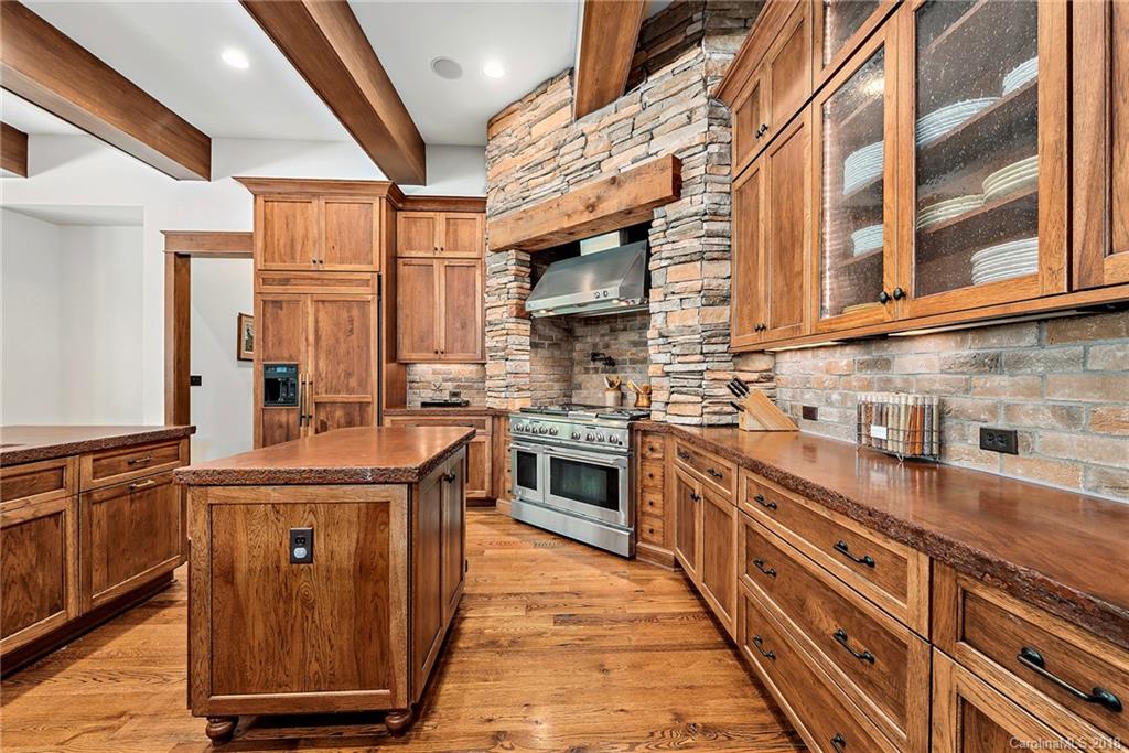 10900 Unity Church Road Mooresville, NC 28115 - Photo 11 of 31 a kitchen with stainless steel appliances granite countertop a sink a stove and cabinets
