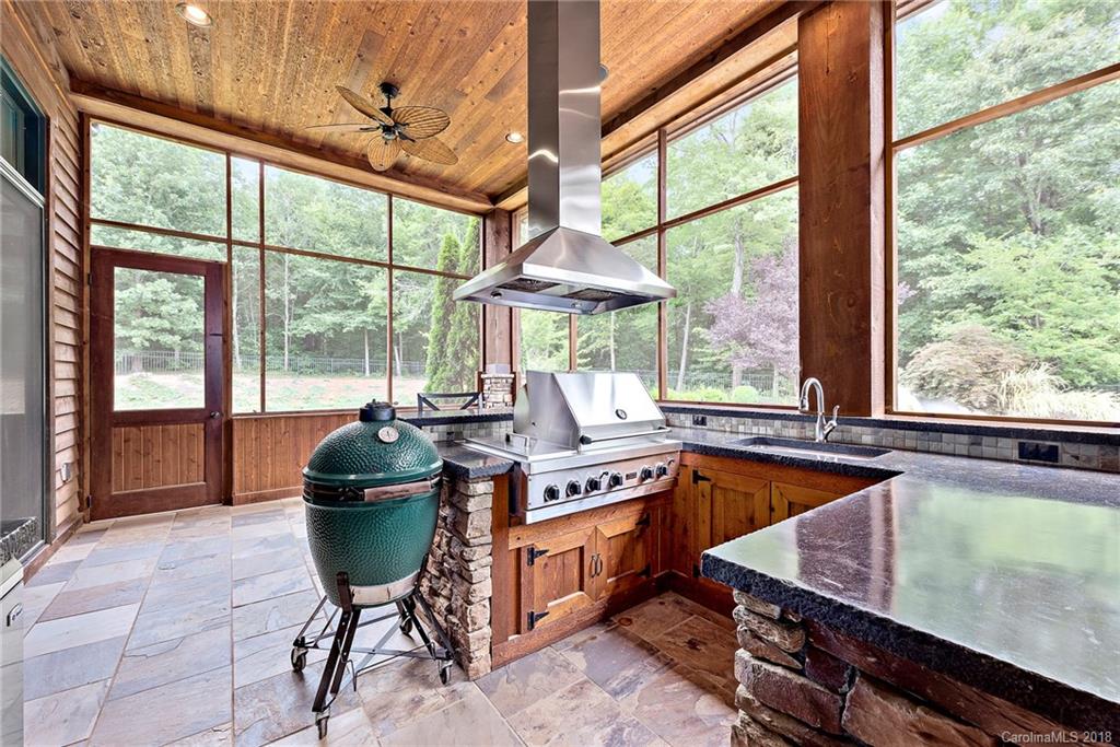 10900 Unity Church Road Mooresville, NC 28115 - Photo 14 of 31 a kitchen with a stove a sink and a wooden cabinets