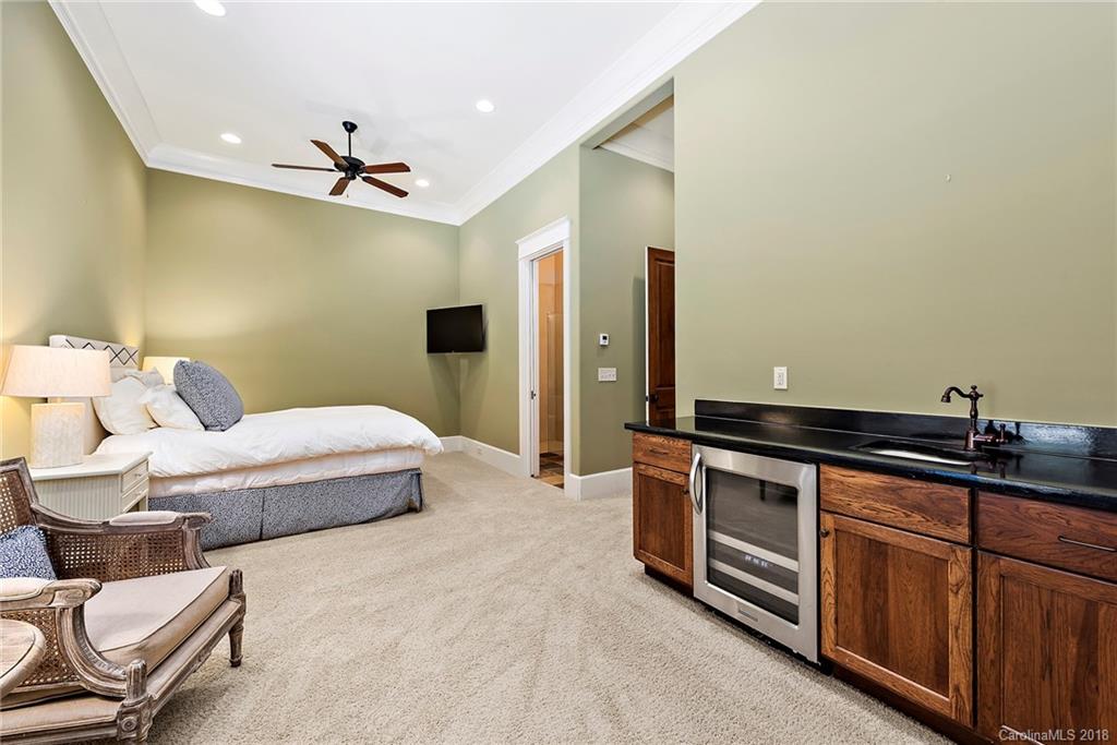 10900 Unity Church Road Mooresville, NC 28115 - Photo 19 of 31 a spacious bedroom with a bed and furniture