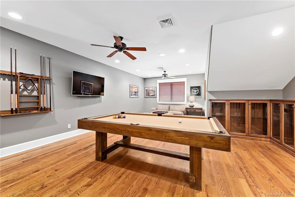 10900 Unity Church Road Mooresville, NC 28115 - Photo 21 of 31 a room with pool table flat screen tv and couches