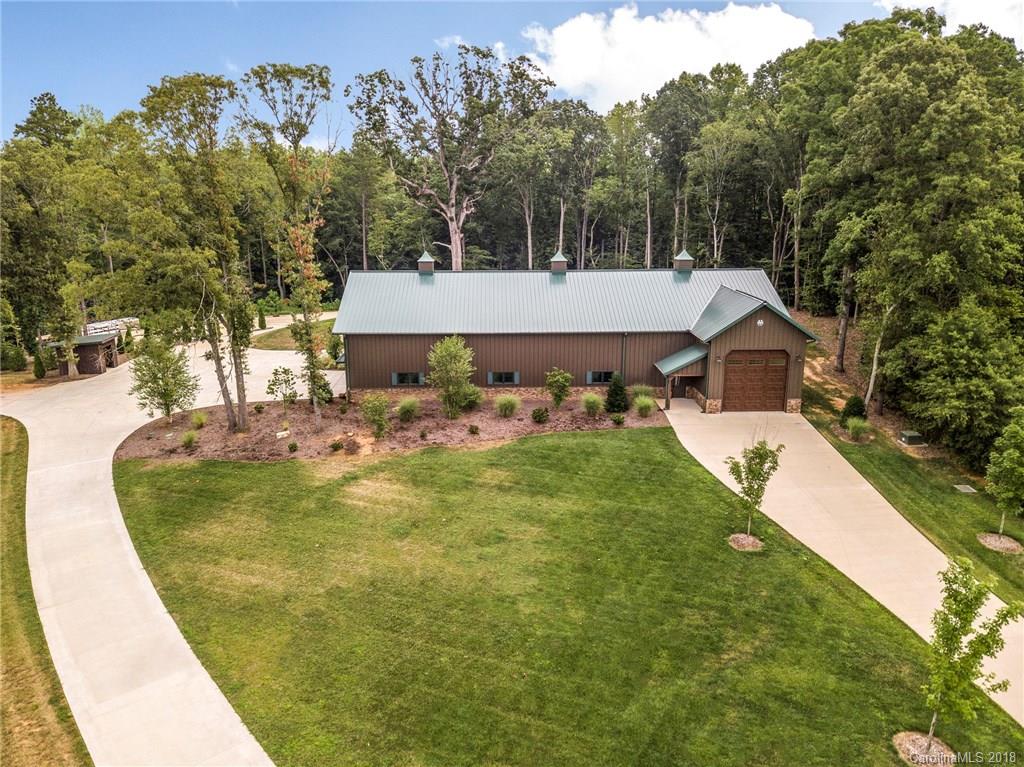 10900 Unity Church Road Mooresville, NC 28115 - Photo 27 of 31 a view of a white house with a swimming pool and a yard