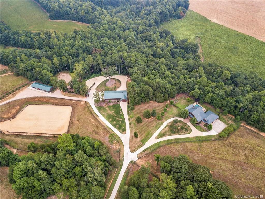 10900 Unity Church Road Mooresville, NC 28115 - Photo 4 of 31 an aerial view of a house with a yard and lake view