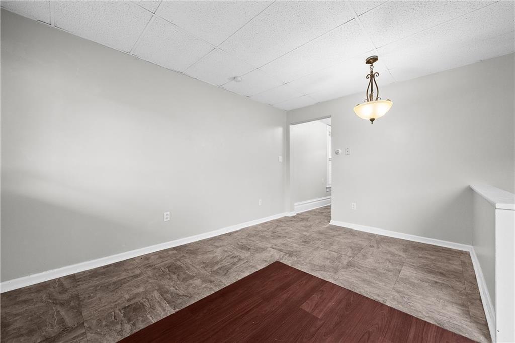 107 Dickman Street Carnegie, PA 15106 - Photo 11 of 47 an empty room with wooden floor and windows