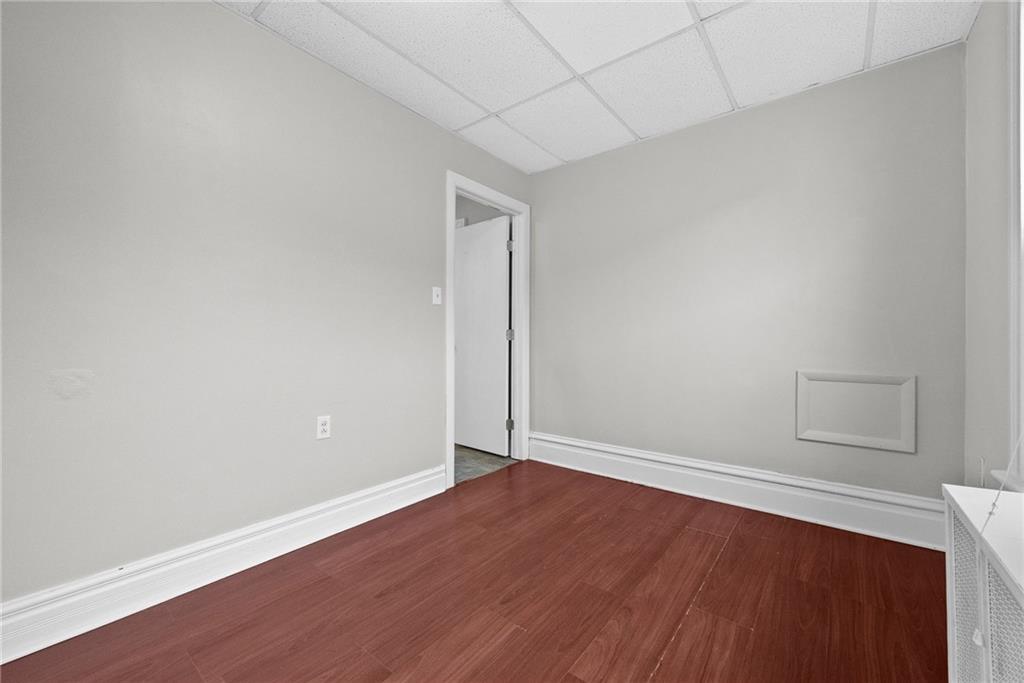 107 Dickman Street Carnegie, PA 15106 - Photo 15 of 47 an empty room with wooden floor and windows