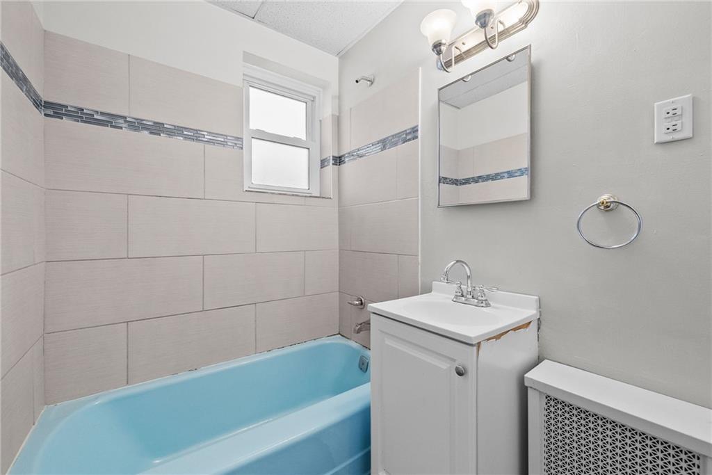 107 Dickman Street Carnegie, PA 15106 - Photo 17 of 47 a bathroom with a sink a toilet and shower