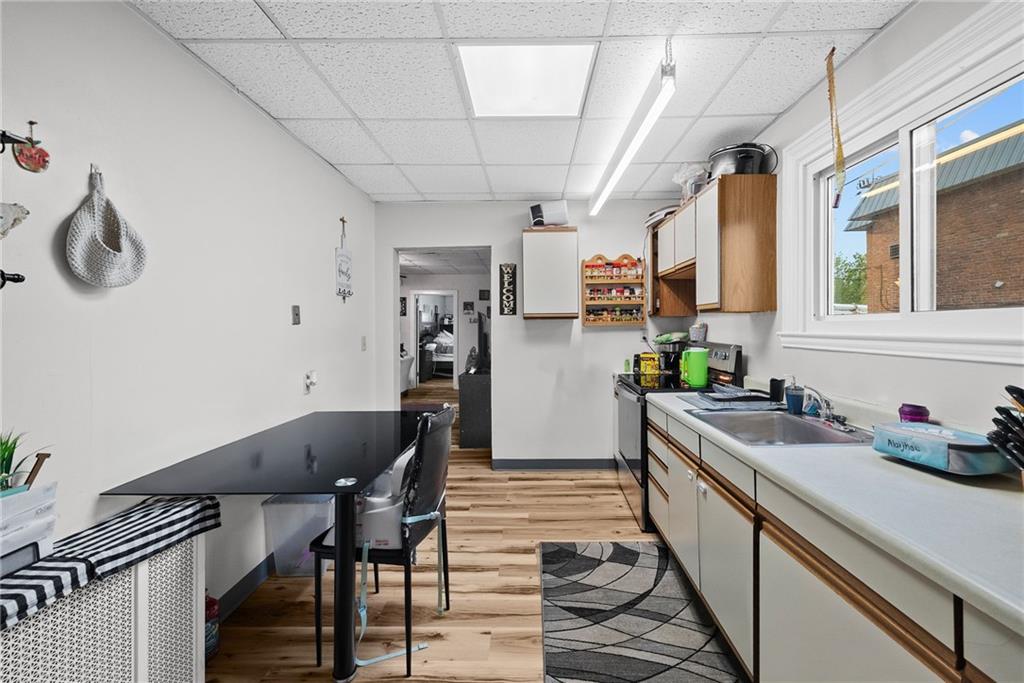 107 Dickman Street Carnegie, PA 15106 - Photo 28 of 47 a kitchen with stainless steel appliances granite countertop a sink and a refrigerator