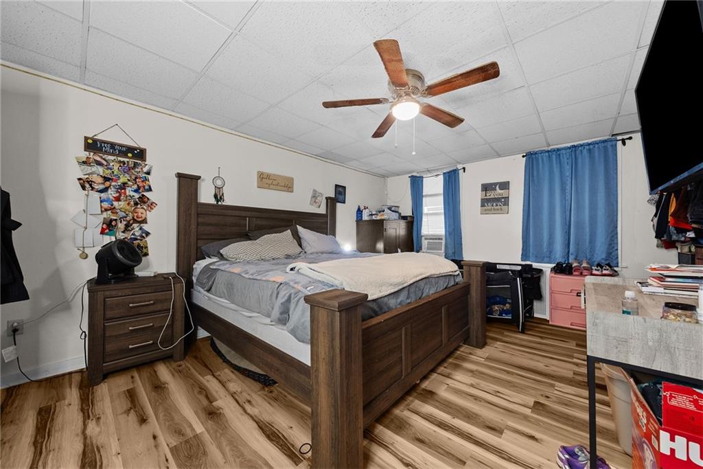 107 Dickman Street Carnegie, PA 15106 - Photo 30 of 47 a spacious bedroom with a bed and a flat screen tv