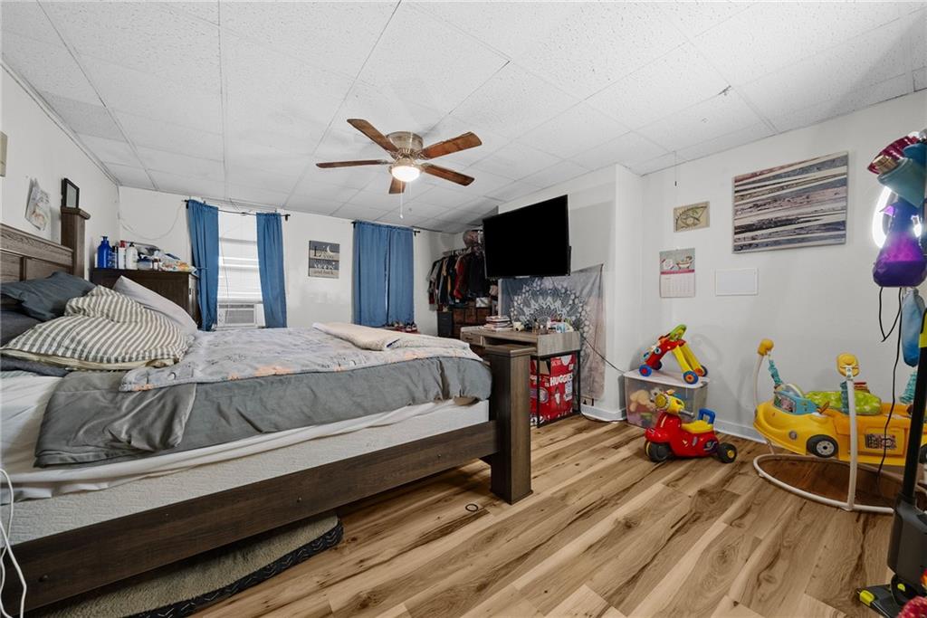 107 Dickman Street Carnegie, PA 15106 - Photo 32 of 47 a bedroom with furniture and a wooden floor