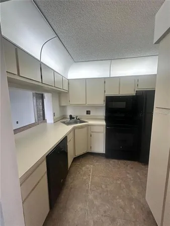 a kitchen with a cabinets and appliances