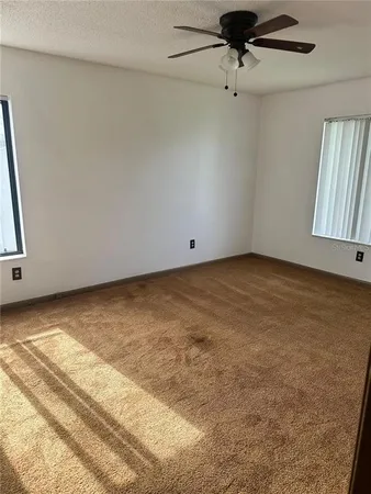 en empty room with windows