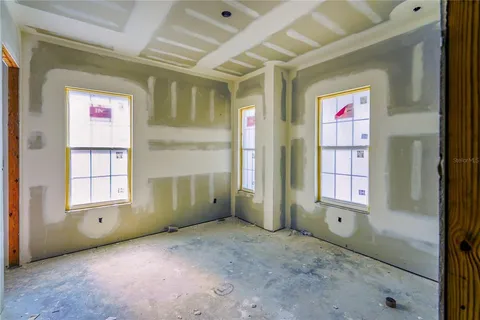an empty room with windows