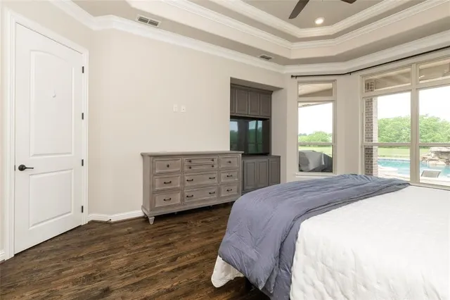 a bed room with a bed and a television