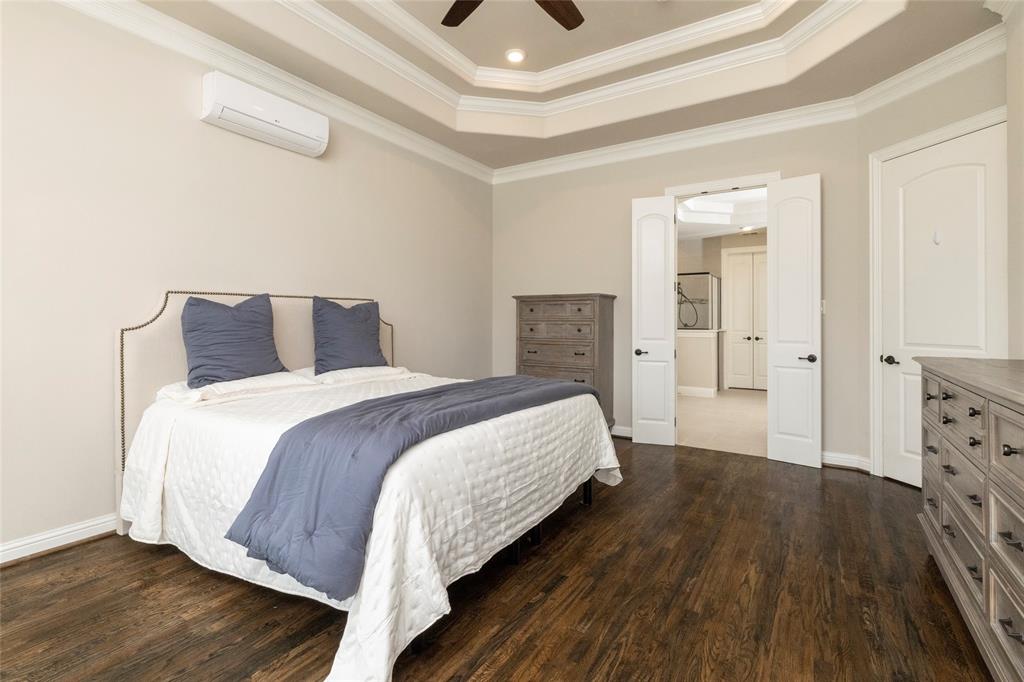 1413 Artesia Lane McLendon-Chisholm, TX 75032 - Photo 17 of 40 a bedroom with a bed and wooden floor