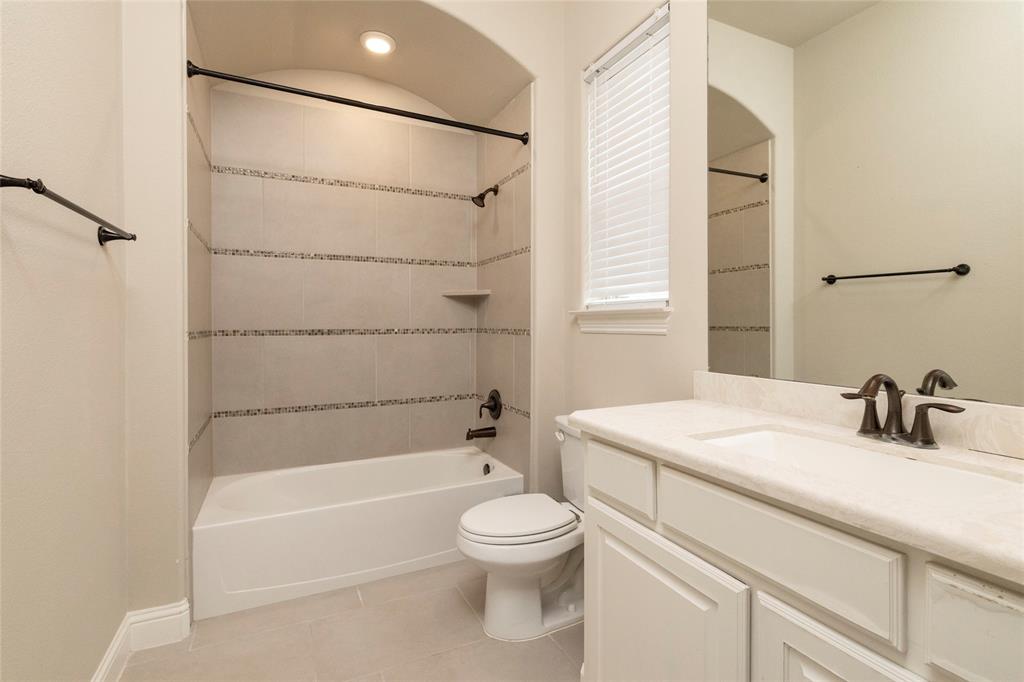 1413 Artesia Lane McLendon-Chisholm, TX 75032 - Photo 23 of 40 a bathroom with a sink toilet and shower