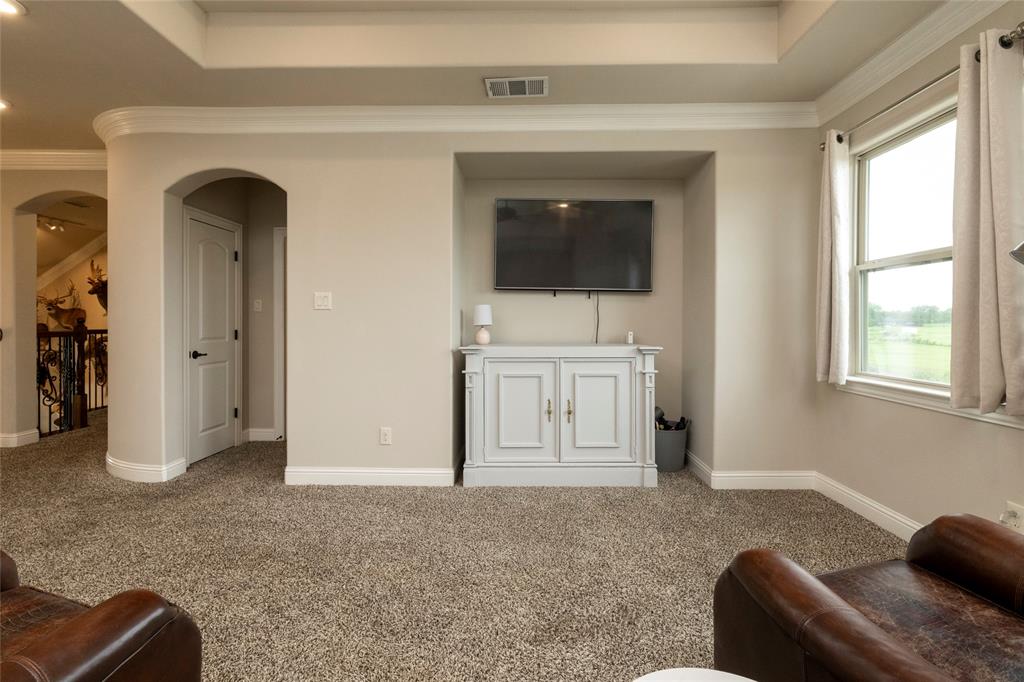 1413 Artesia Lane McLendon-Chisholm, TX 75032 - Photo 28 of 40 a living room with furniture and a flat screen tv
