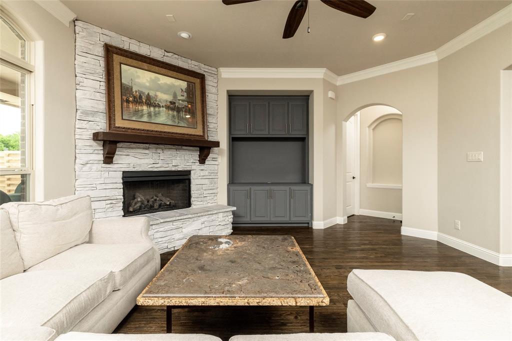 1413 Artesia Lane McLendon-Chisholm, TX 75032 - Photo 8 of 40 a living room with furniture and a fireplace