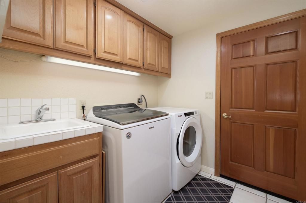 23509 Barona Mesa Road Ramona, CA 92065 - Photo 15 of 34 a utility room with dryer and washer