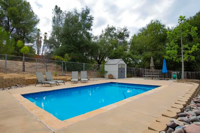 a view of a swimming pool with a lounge chair