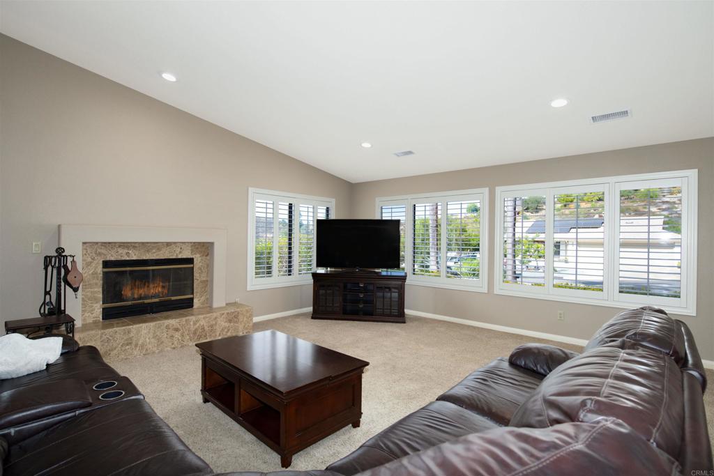 23509 Barona Mesa Road Ramona, CA 92065 - Photo 4 of 34 a living room with furniture and a fireplace