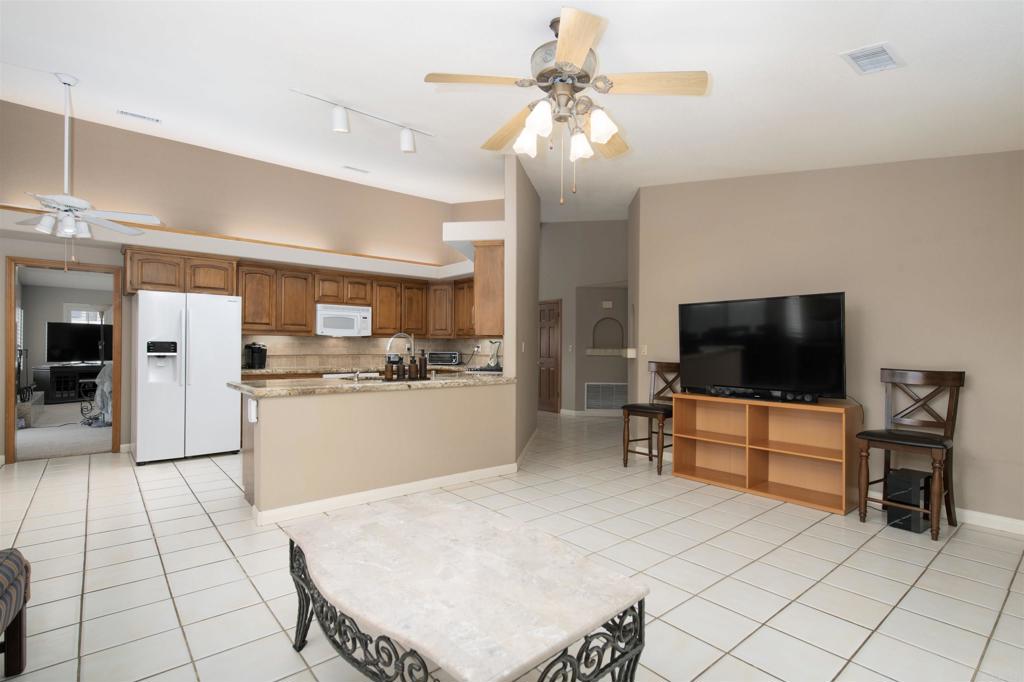 23509 Barona Mesa Road Ramona, CA 92065 - Photo 10 of 34 a living room with furniture and flat screen tv