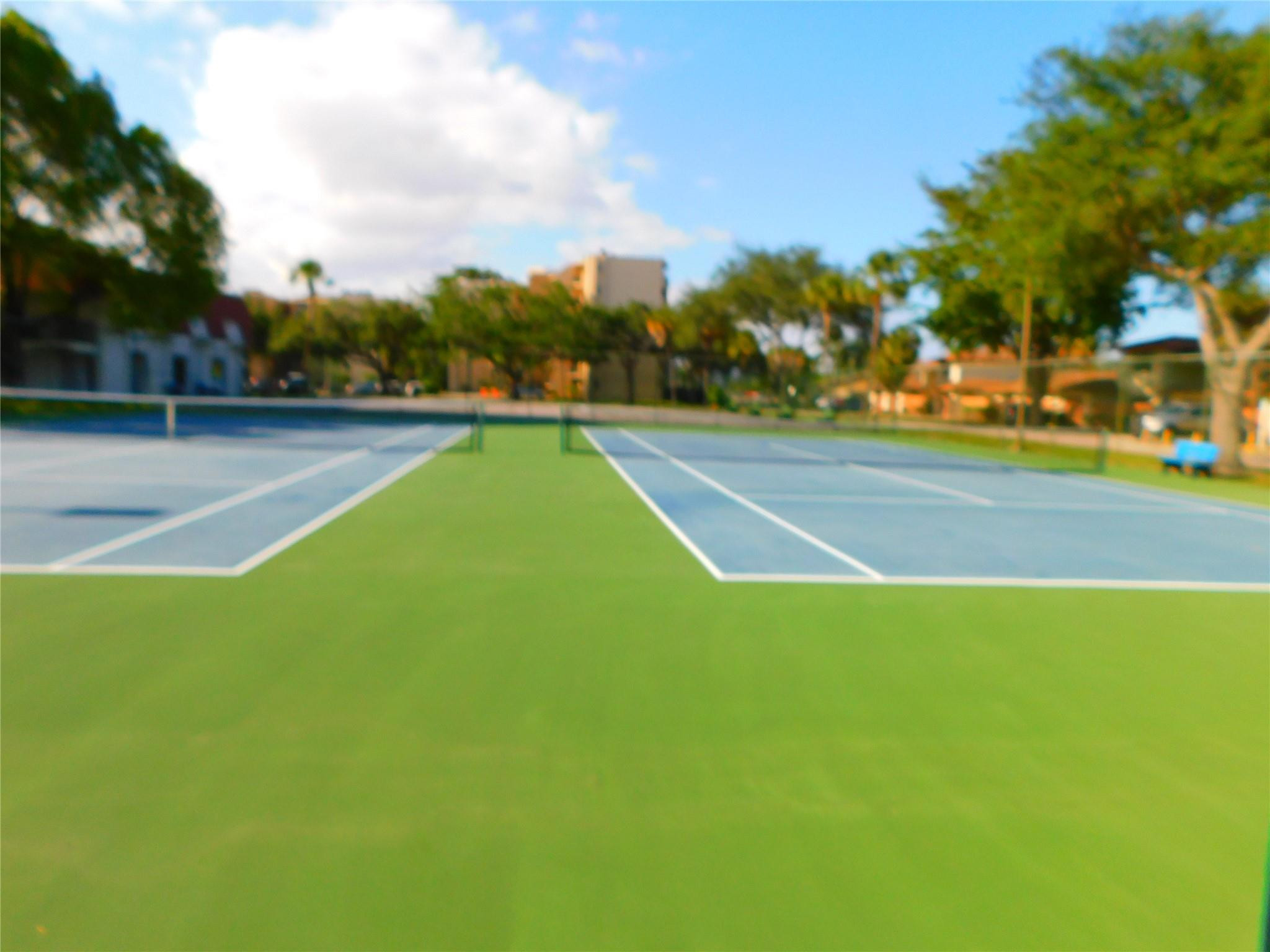 3370 Beau Rivage Drive, Unit 2A Pompano Beach, FL 33064 - Photo 37 of 40 Tennis courts