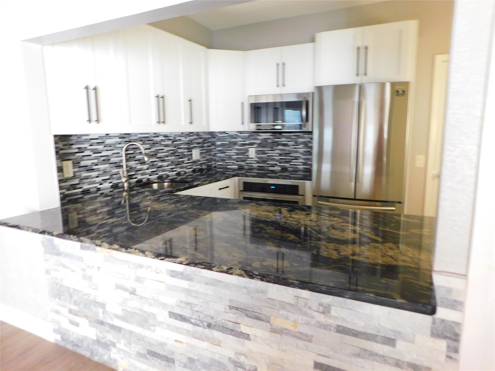 3370 Beau Rivage Drive, Unit 2A Pompano Beach, FL 33064 - Photo 39 of 40 Clubhouse party room kitchen.