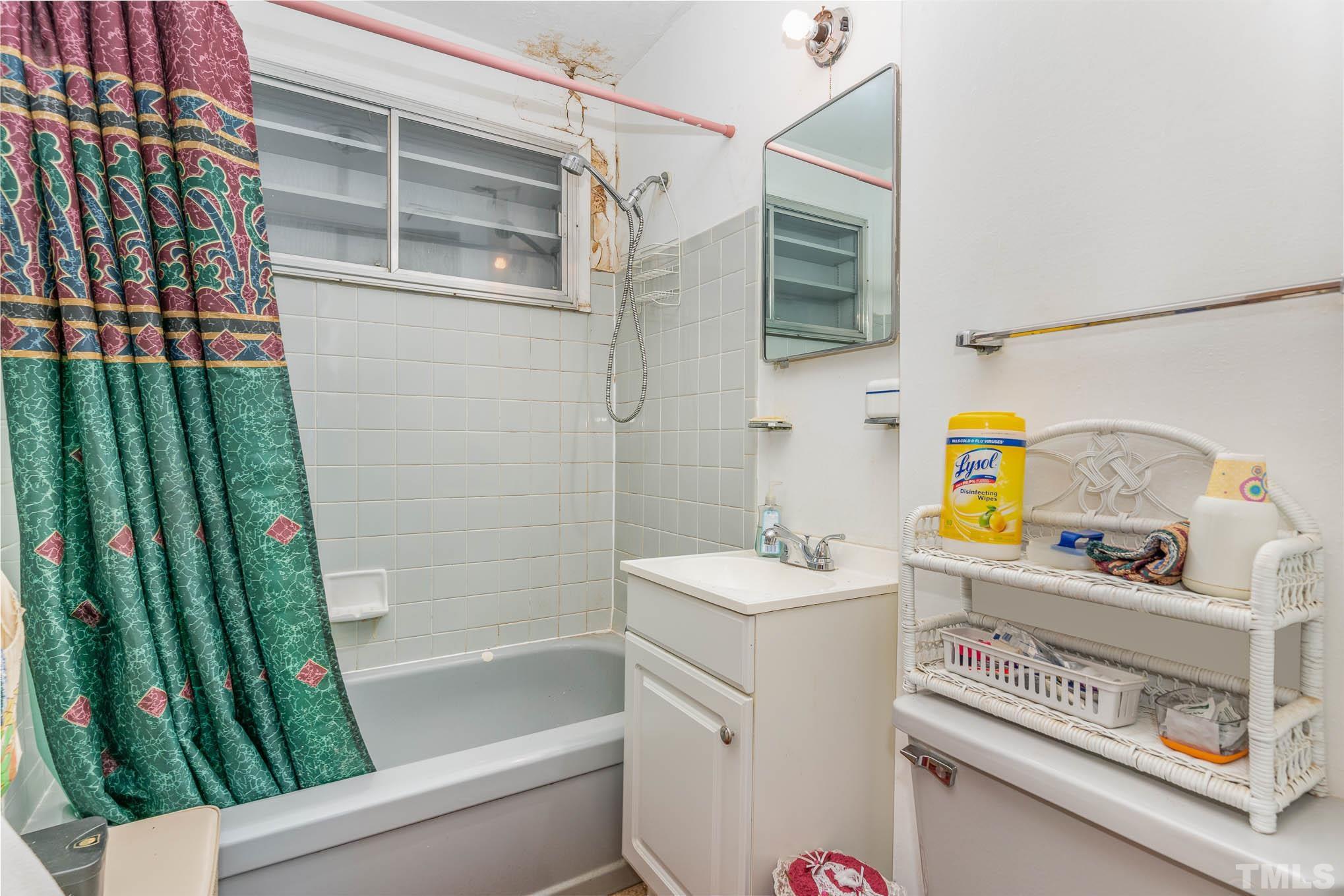 843 Hadley Road Raleigh, NC 27610 - Photo 14 of 28 a bathroom with a sink a toilet and shower