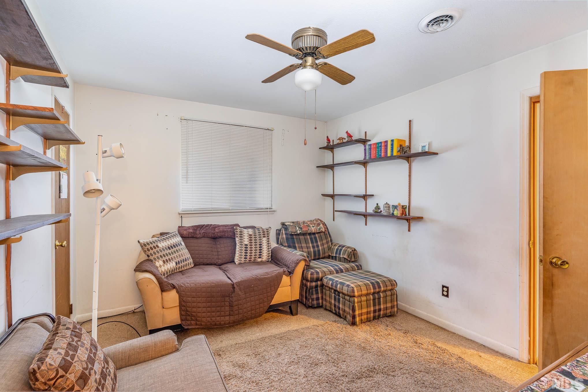 843 Hadley Road Raleigh, NC 27610 - Photo 16 of 28 a living room with furniture and a table