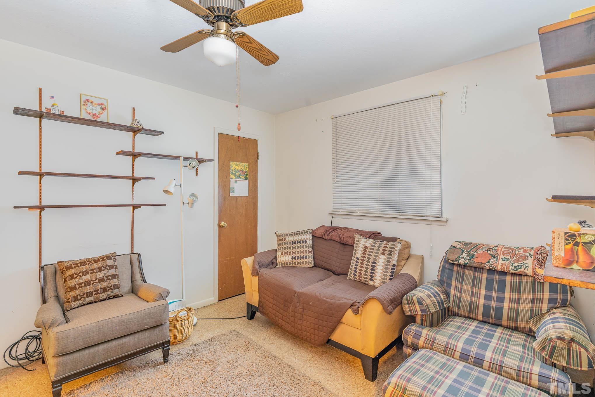 843 Hadley Road Raleigh, NC 27610 - Photo 17 of 28 a bedroom with furniture and a couch