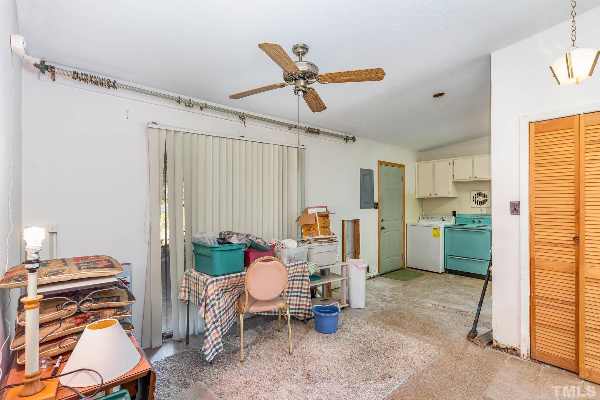 843 Hadley Road Raleigh, NC 27610 - Photo 22 of 28 a workspace with furniture and a window