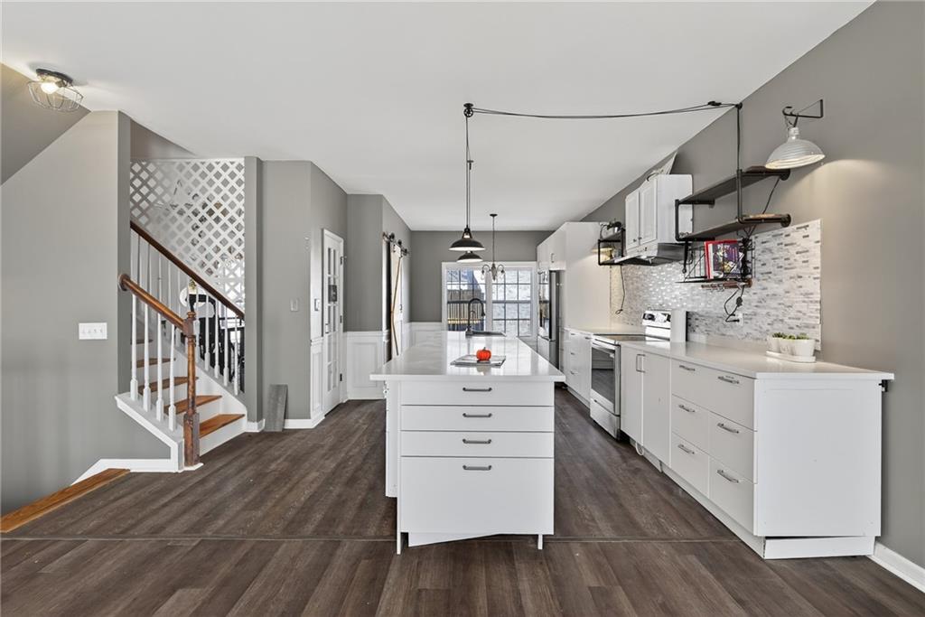 1644 Sandy Beach Point Lawrenceville, GA 30043 - Photo 23 of 60 a view of a kitchen with cabinets and wooden floor