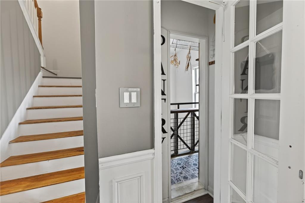 1644 Sandy Beach Point Lawrenceville, GA 30043 - Photo 30 of 60 a view of a hallway with wooden floor and entryway