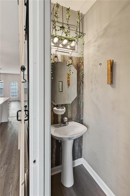 1644 Sandy Beach Point Lawrenceville, GA 30043 - Photo 35 of 60 a bathroom with a sink and mirror