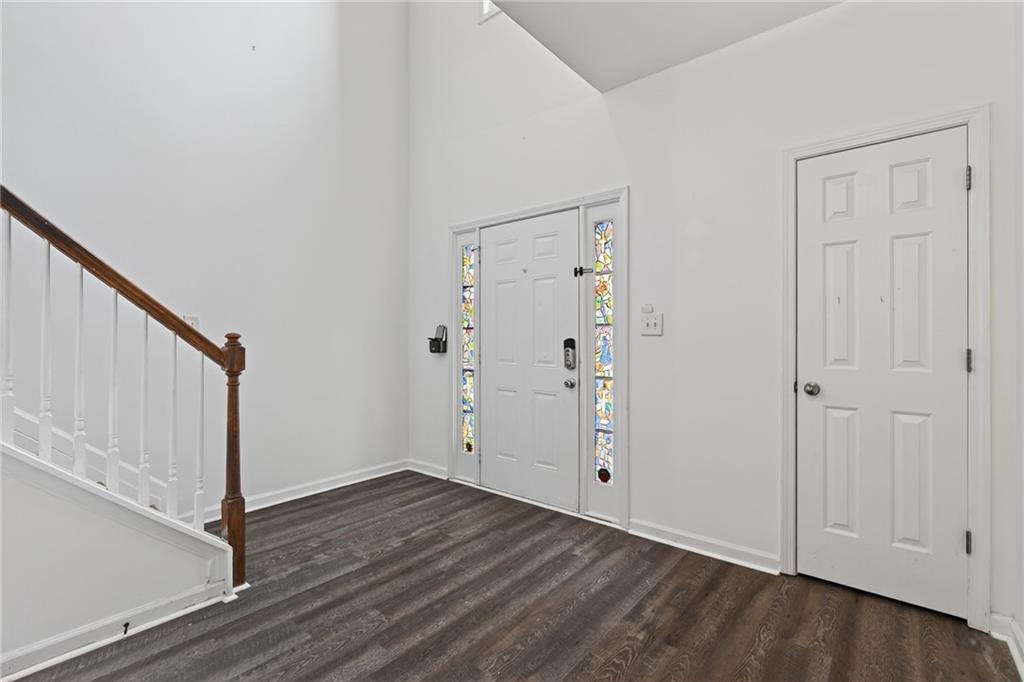 1644 Sandy Beach Point Lawrenceville, GA 30043 - Photo 5 of 60 an empty room with wooden floor