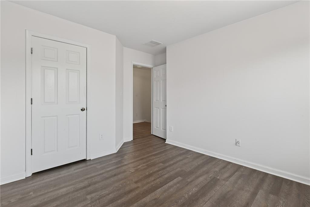 1644 Sandy Beach Point Lawrenceville, GA 30043 - Photo 51 of 60 a view of an empty room with wooden floor