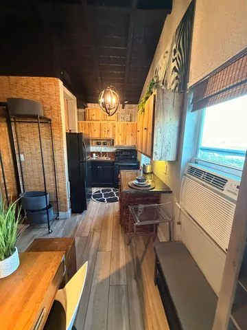 a view of balcony with wooden floor and outdoor seating