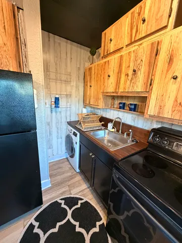 a bathroom with a sink a toilet and a window