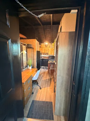 a view of balcony with wooden floor