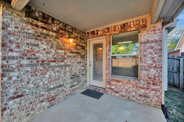 a bathroom with a shower and a sink