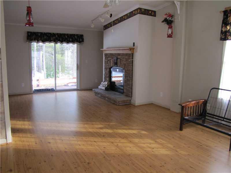 653 Nash Road Pittston, ME 04345 - Photo 4 of 19 Living Room. Gas fireplace, new...