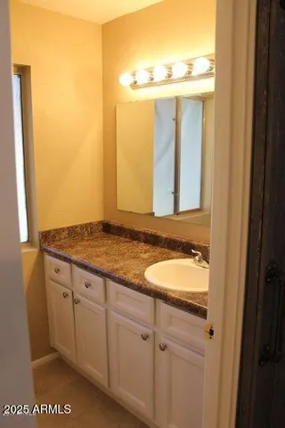 a white toilet sitting next to a bath tub