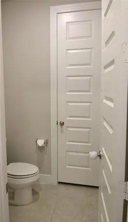 a bathroom with a toilet and a vanity