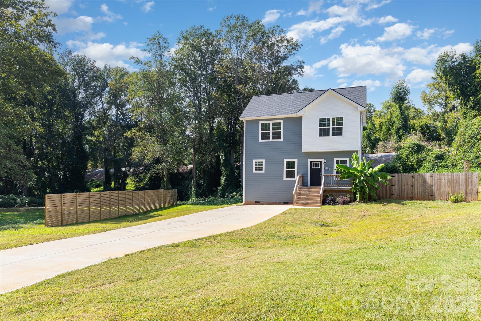 1003 Hunter Valley Road Shelby, NC 28150 - Photo 2 of 23 a front view of a house with a yard