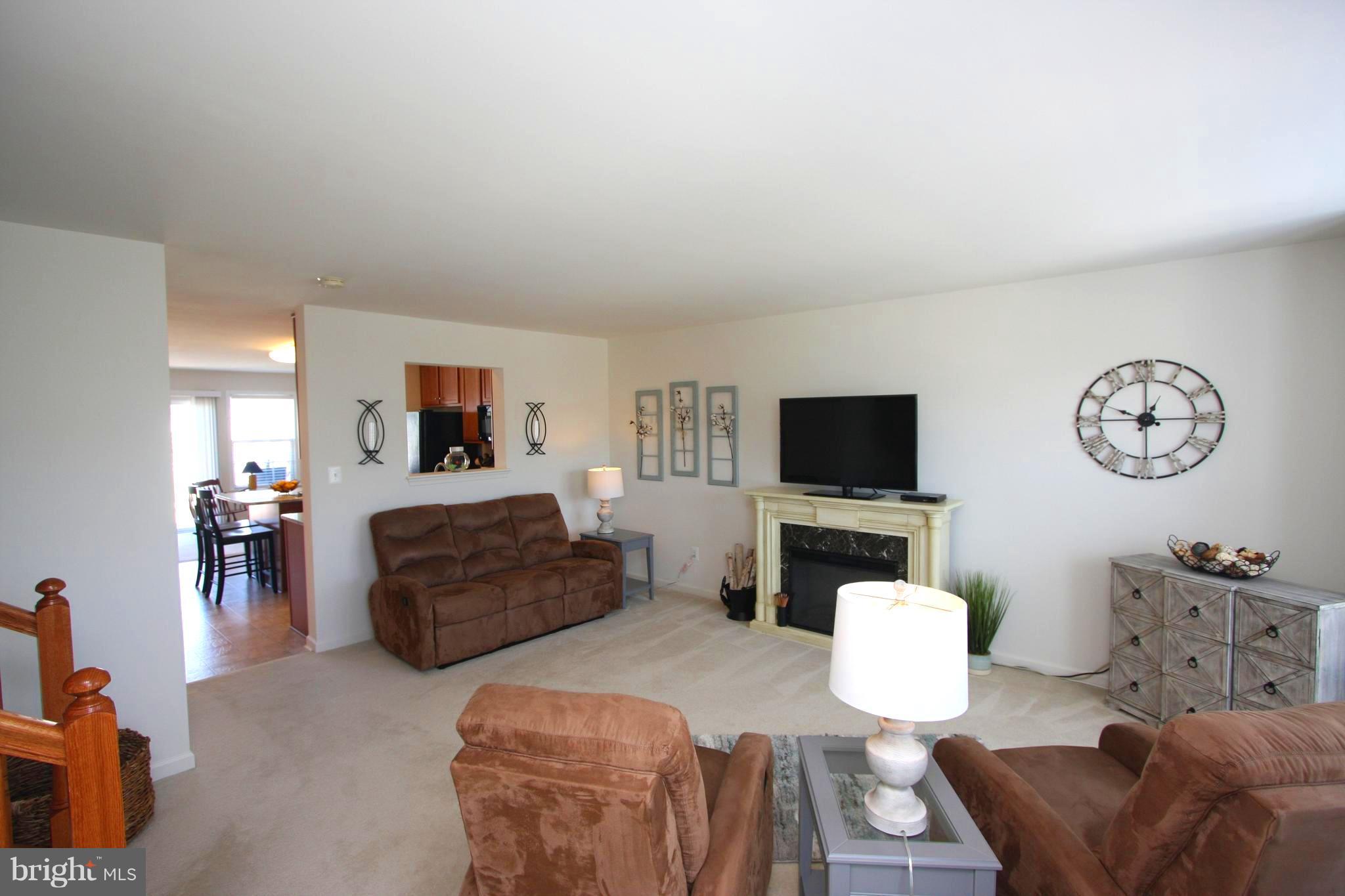 1209 Steed Street Ranson, WV 25438 - Photo 14 of 30 a living room with furniture a flat screen tv and a couch