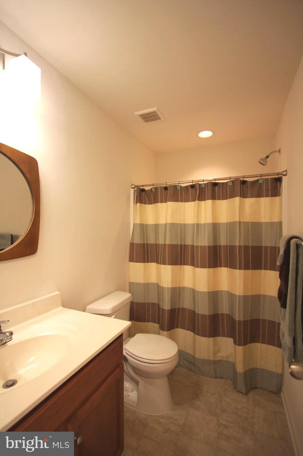 1209 Steed Street Ranson, WV 25438 - Photo 22 of 30 a bathroom with a sink a toilet and a mirror