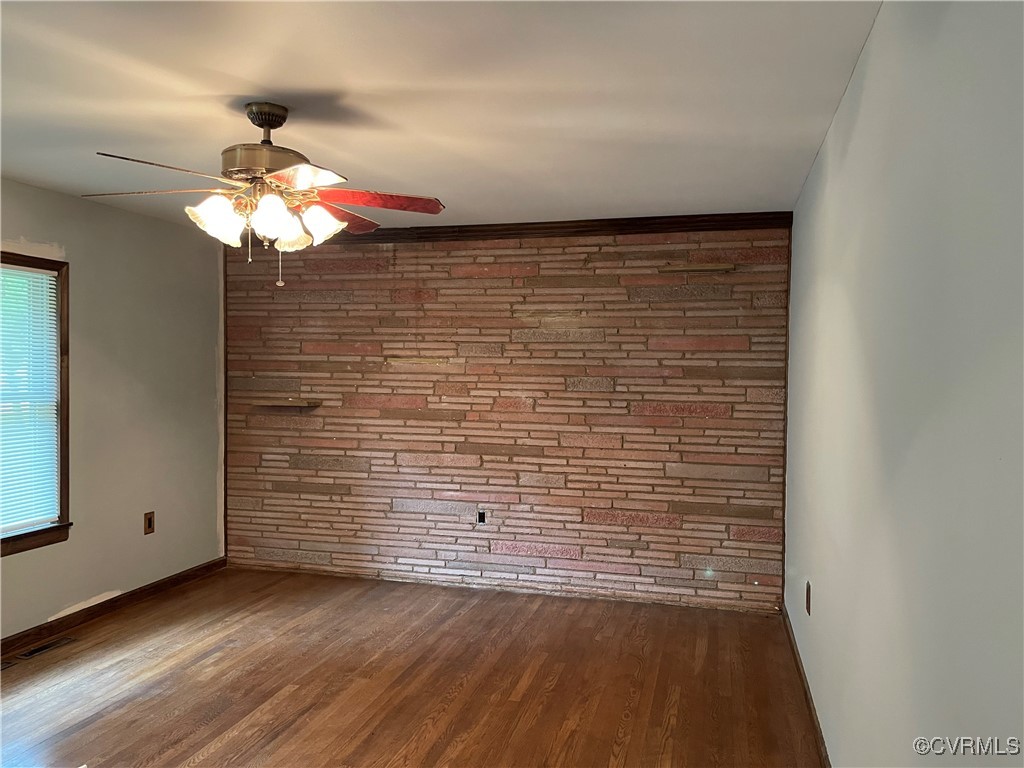 2806 Trarich Road Petersburg, VA 23805 - Photo 12 of 14 Spare room with ceiling fan and dark wood-type flo