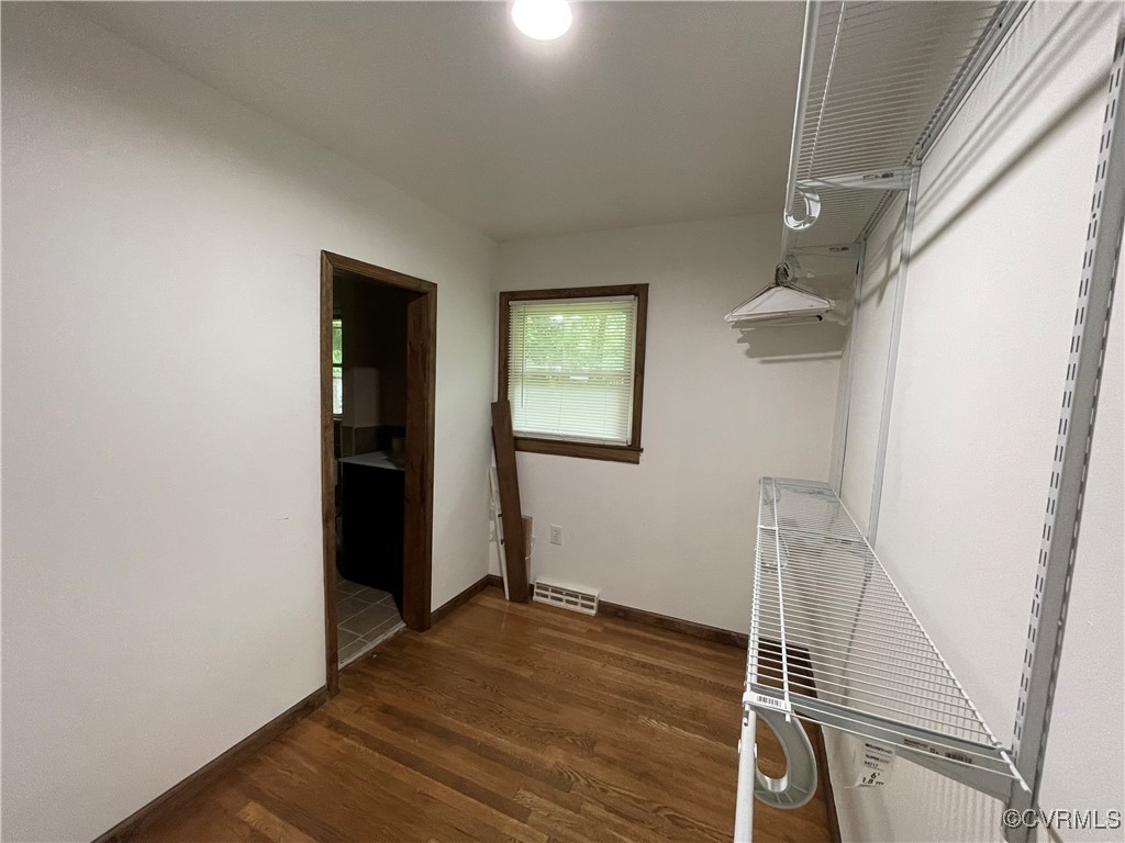 2806 Trarich Road Petersburg, VA 23805 - Photo 3 of 14 Walk in closet with dark wood-type flooring